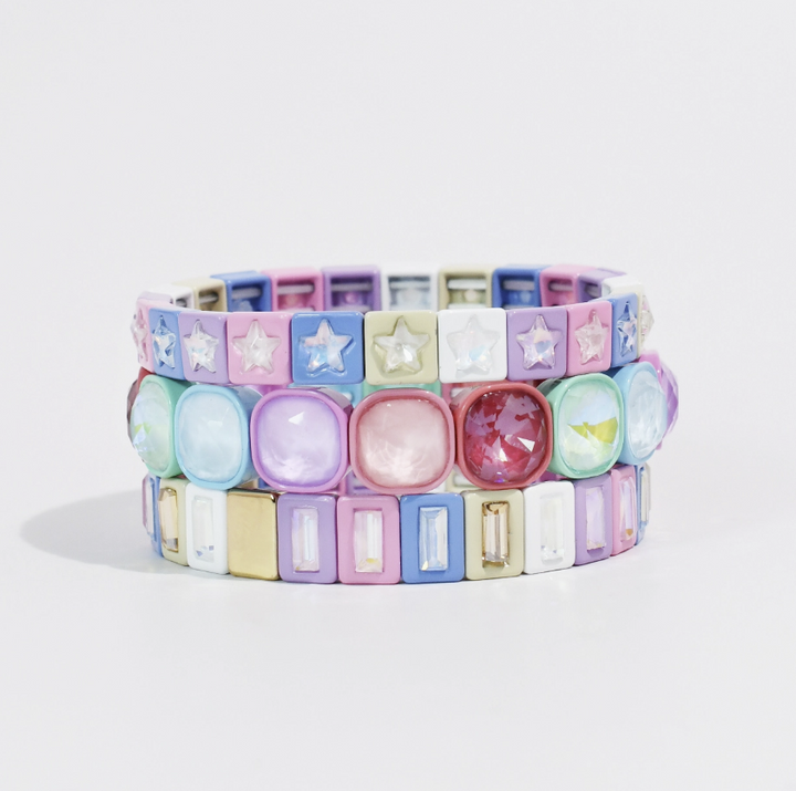 Pastel bracelet stack including three bracelets on white background