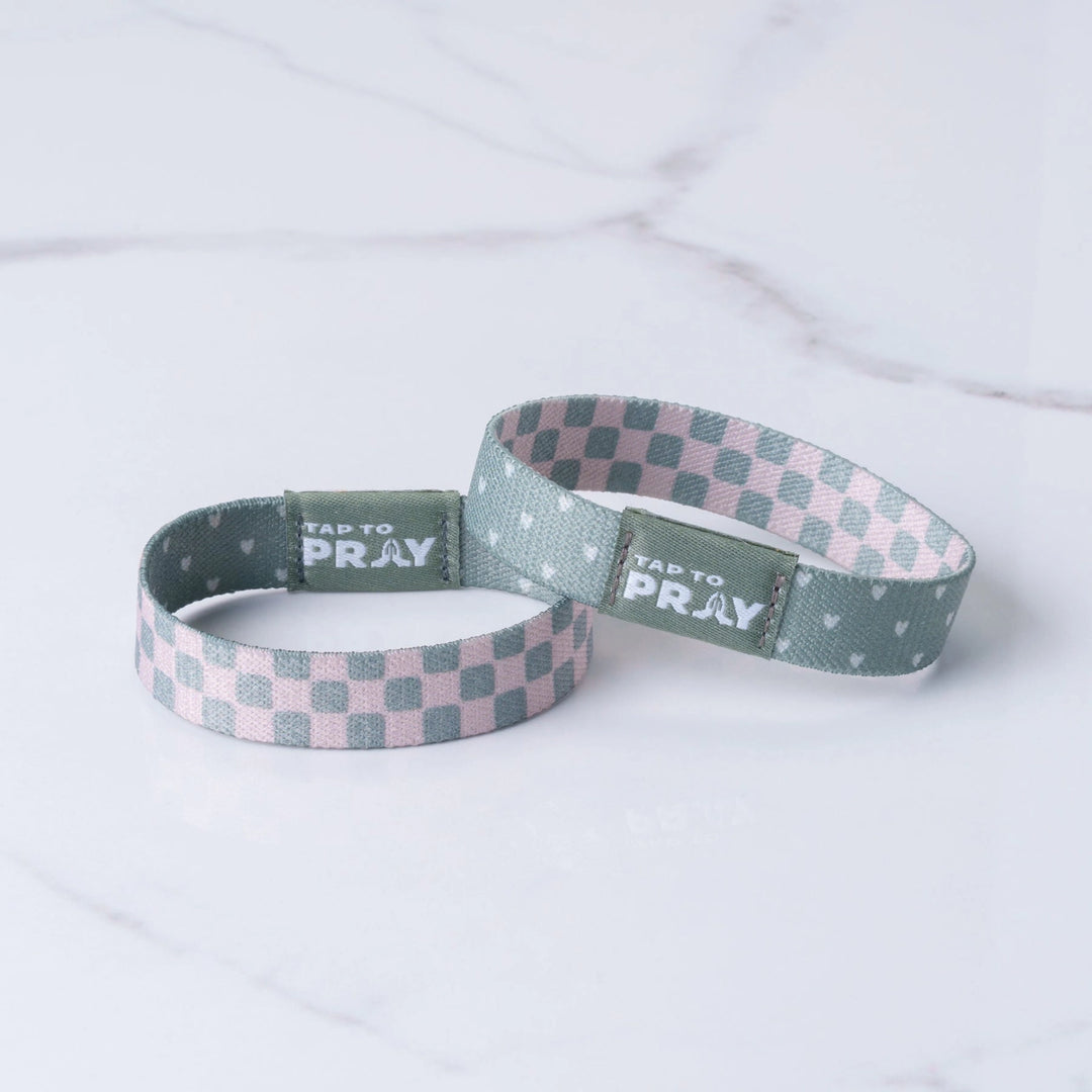 Two checkered wristbands with &