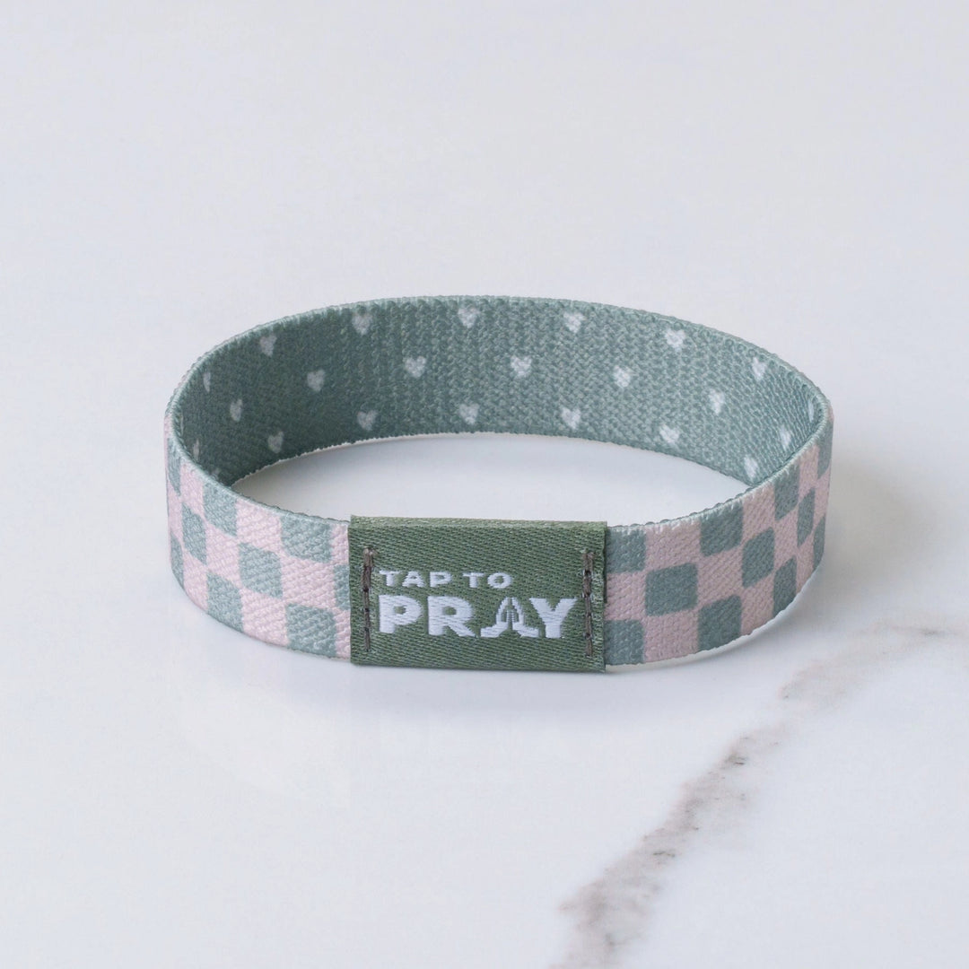 Wristband with checkered pattern and &