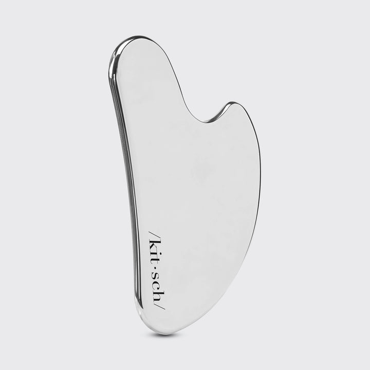 Stainless Steel Gua Sha on plain background