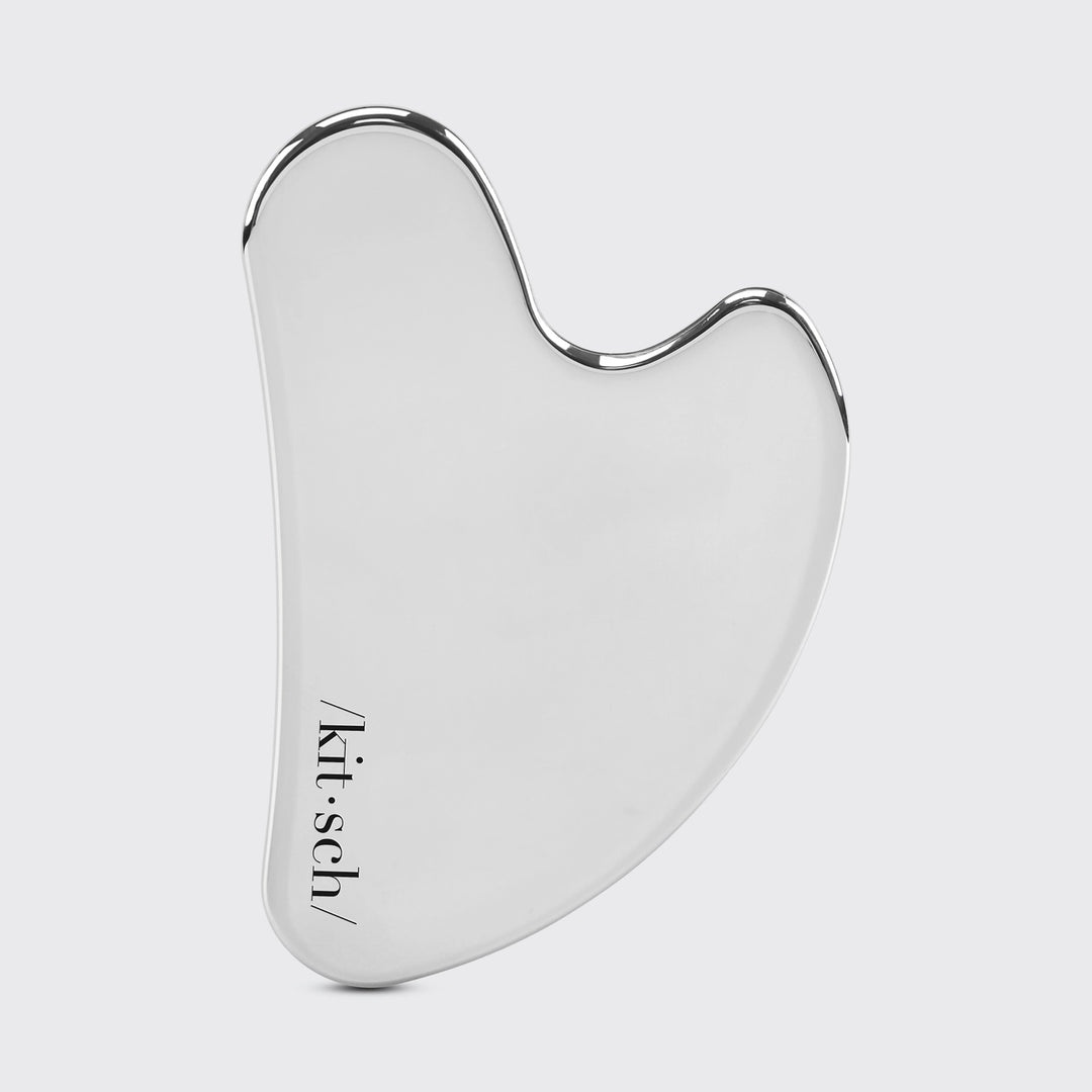 Stainless Steel Gua Sha on plain background
