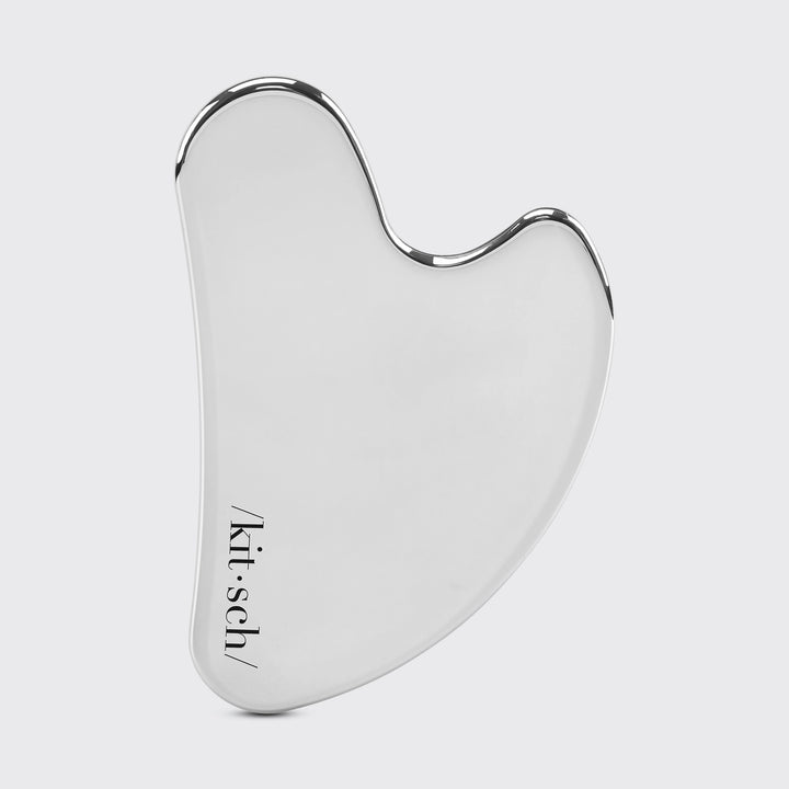 Stainless Steel Gua Sha on plain background