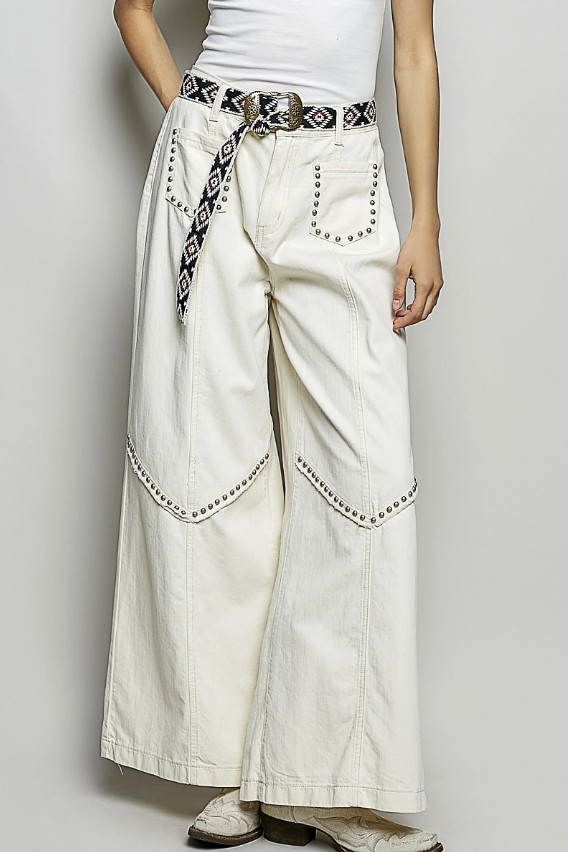 White wide-leg pants with decorative belt and stitching on a plain background