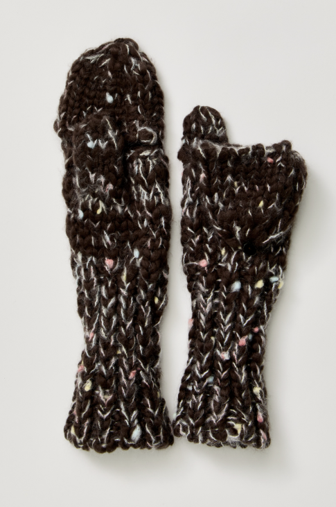 A pair of chunky knit fingerless gloves in a dark brown variegated yarn with flecks of white, pink, and yellow, displayed flat against a light gray background.
