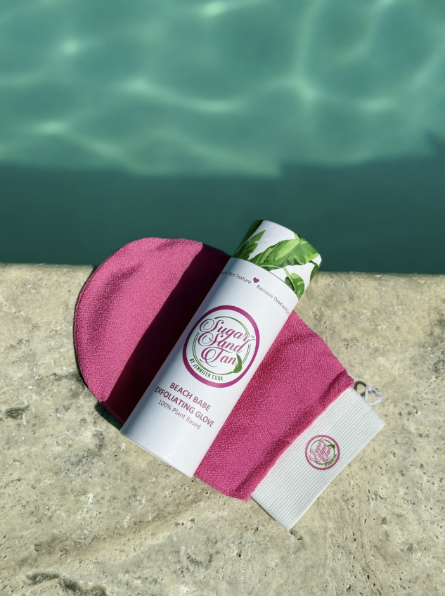Self tanning exfoliating glove displayed in packaging by pool