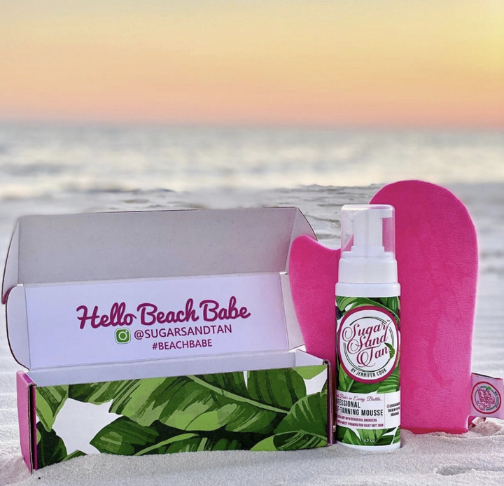 Self tanning product displayed in packaging on beach
