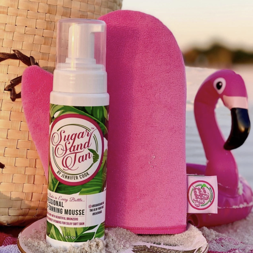 Self Tanning products displayed on beach