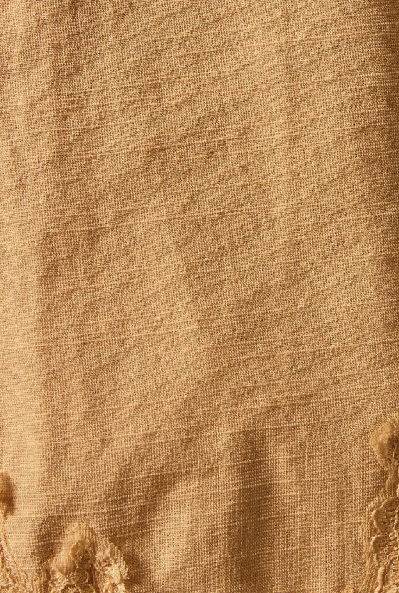Close-up of beige fabric with subtle texture