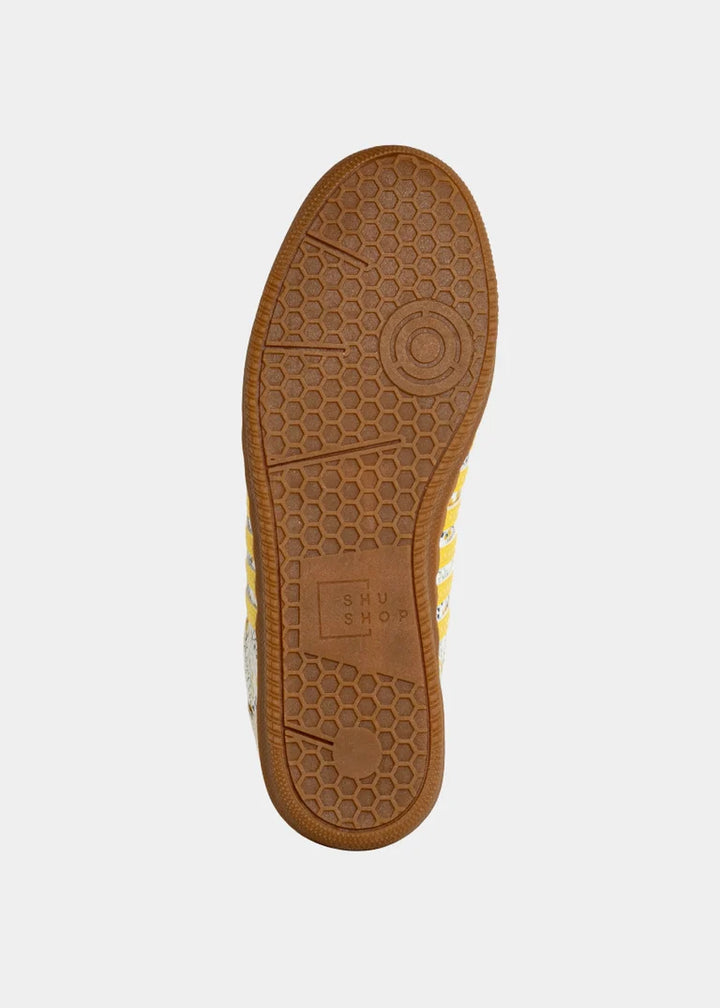 Rubber sole on sneaker on plain background