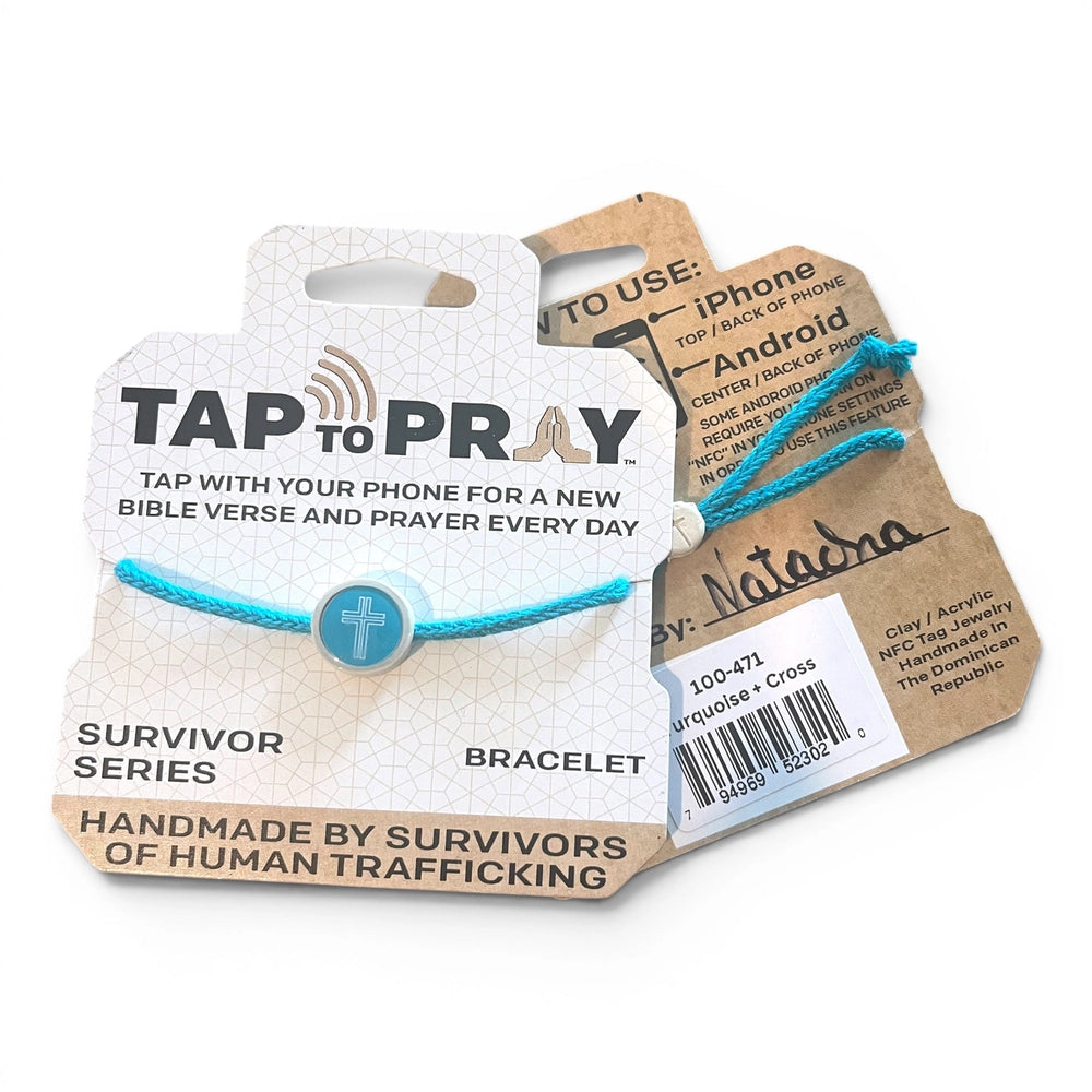 A turquoise cord bracelet with a blue cross charm, displayed on its branded cardboard packaging. The packaging features the text 'TAP TO PRAY' and 'SURVIVOR SERIES'.