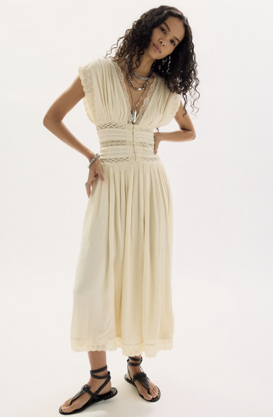 Woman wearing beige dress on white background