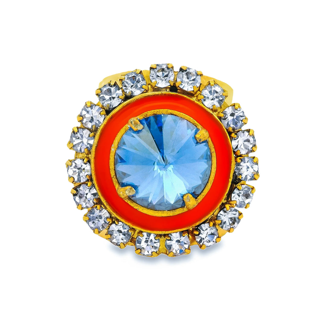 ring with orange enamel and crystals on white background