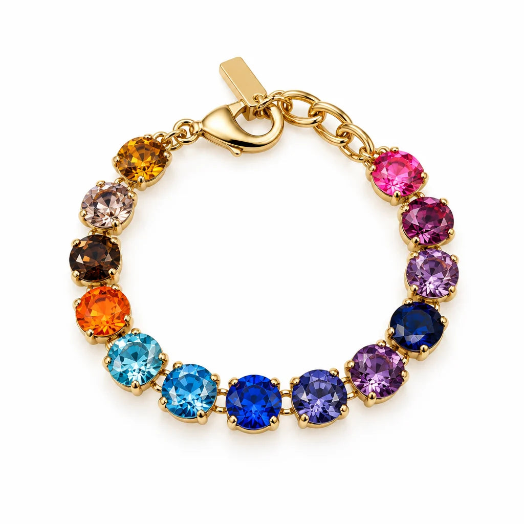 Gold bracelet with multi color Swarovski Crystals and gold lobster clasp on plain background