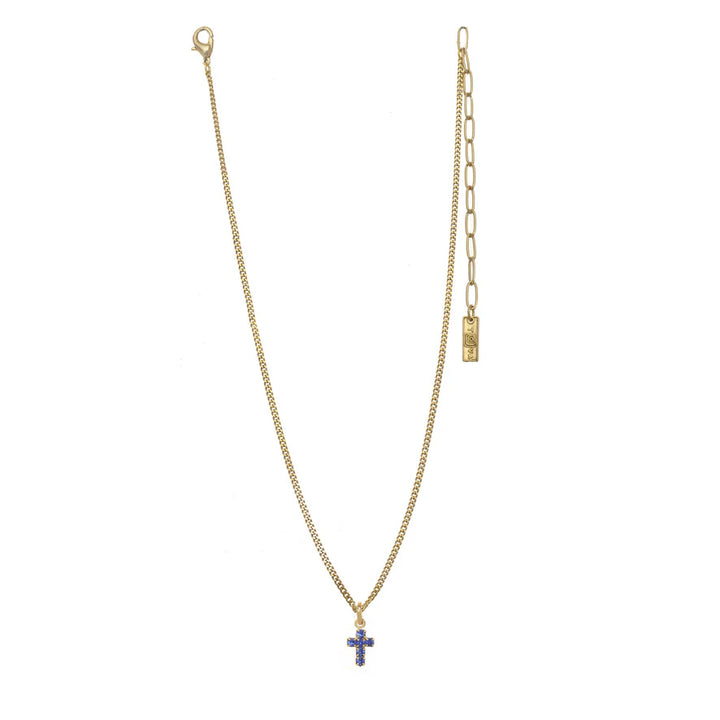 Gold necklace with a cross pendant on a white background