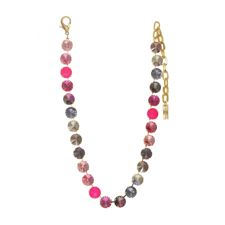 Crystal necklace in pink colors on plain background