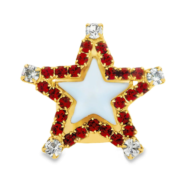 Star shape ring with red and clear crystals around the edge. Baby blue enamel in the center on plain background