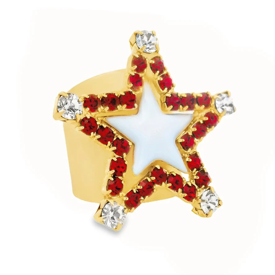 Star shape ring with red and clear crystals around the edges and baby blue enamel in the center on plain background