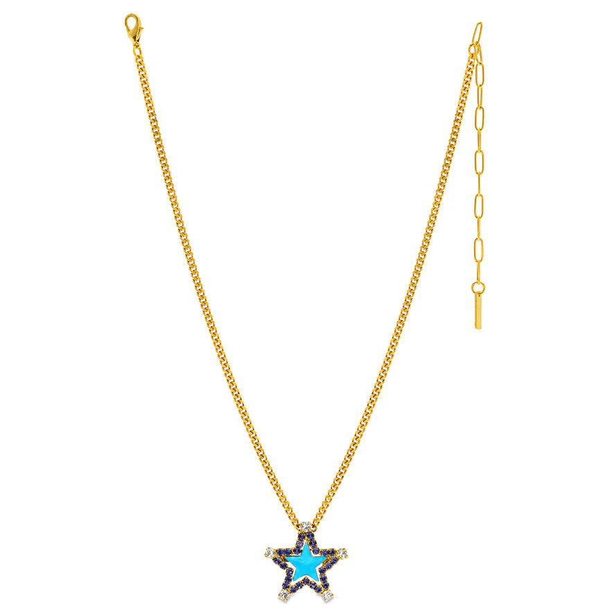 A gold chain necklace featuring a star-shaped pendant with a bright blue center, bordered by small dark stones and clear rhinestones, shown against a plain white background.