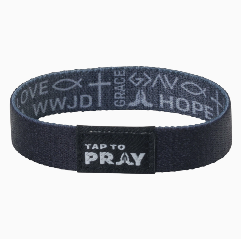 Tap to pray bracelet with symbols of faith on white background