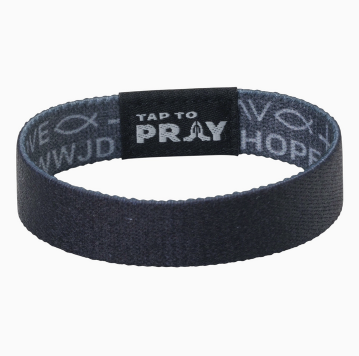 Tap to pray bracelet with symbols of faith on white background