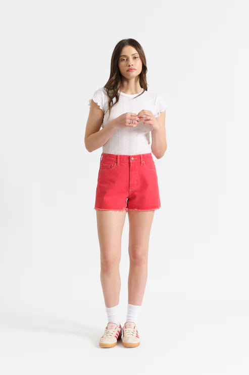 Woman wearing a white t-shirt and red shorts on a white background