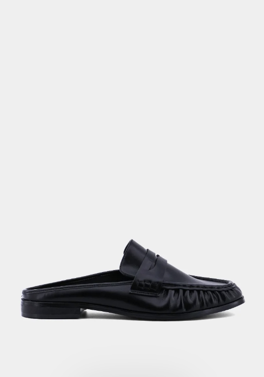 Black leather loafer on white background
