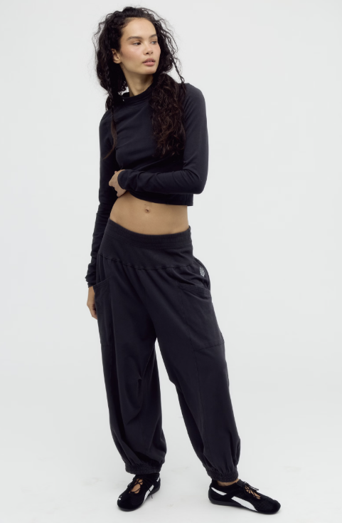 Woman wearing black matching set on white background