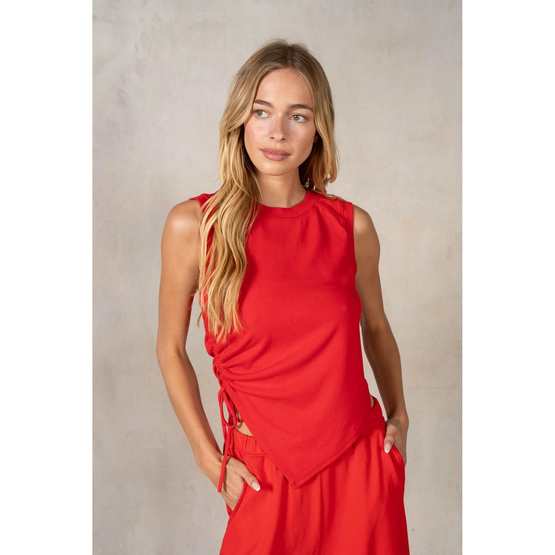 Woman wearing matching red set on plain background