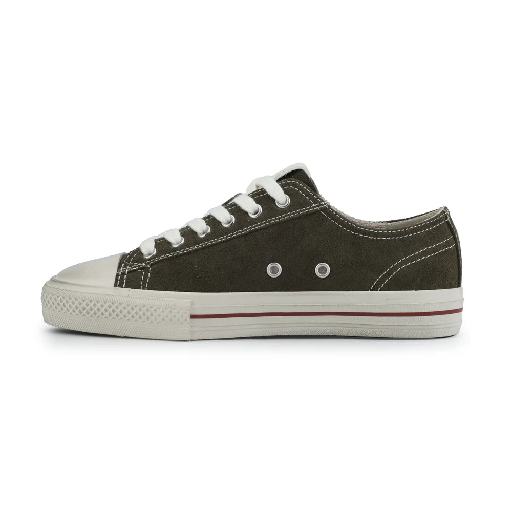 Black running shoe with white sole on a light pink background