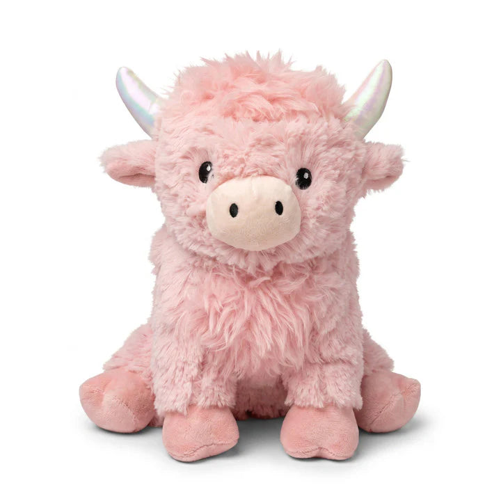 Stuffed pink highland cow on white background
