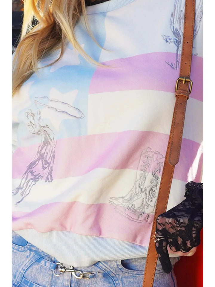 Person wearing a colorful striped shirt with graphic designs and holding a brown leather bag.
