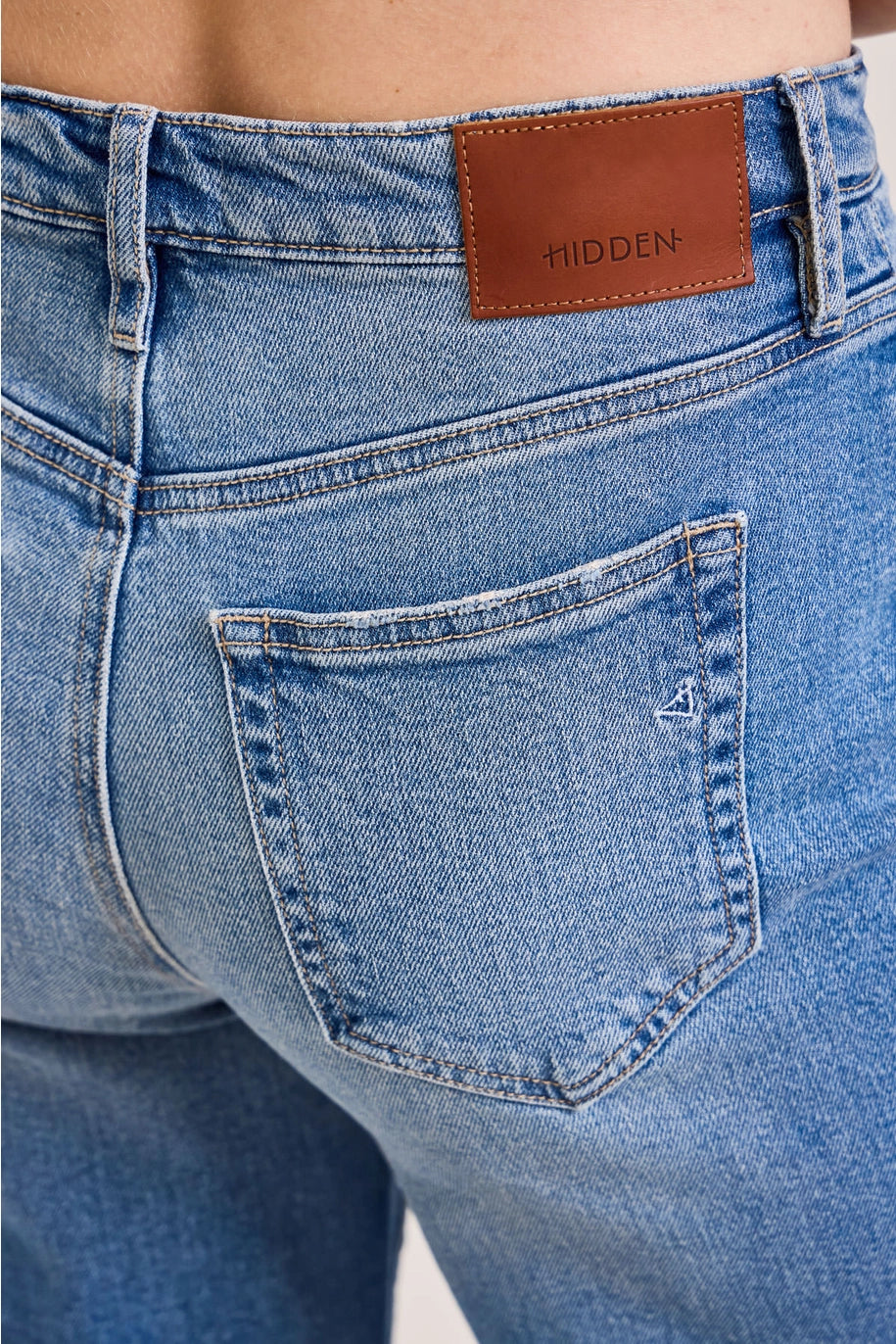 Back of denim pants with patch saying &