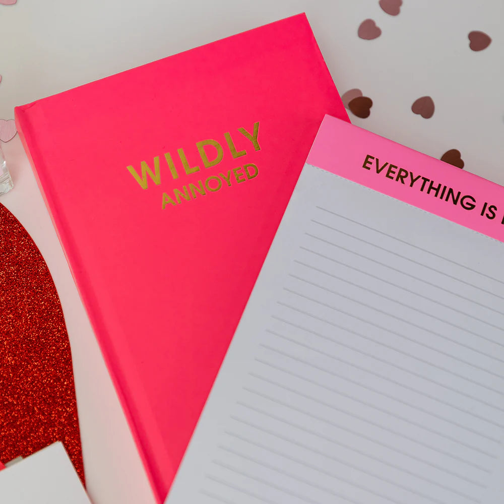 Bright pink journal on white background