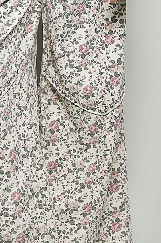 Floral patterned garment on a plain background