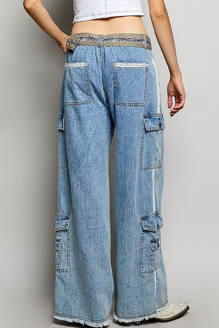 Wide-leg jeans with multiple pockets on a plain background