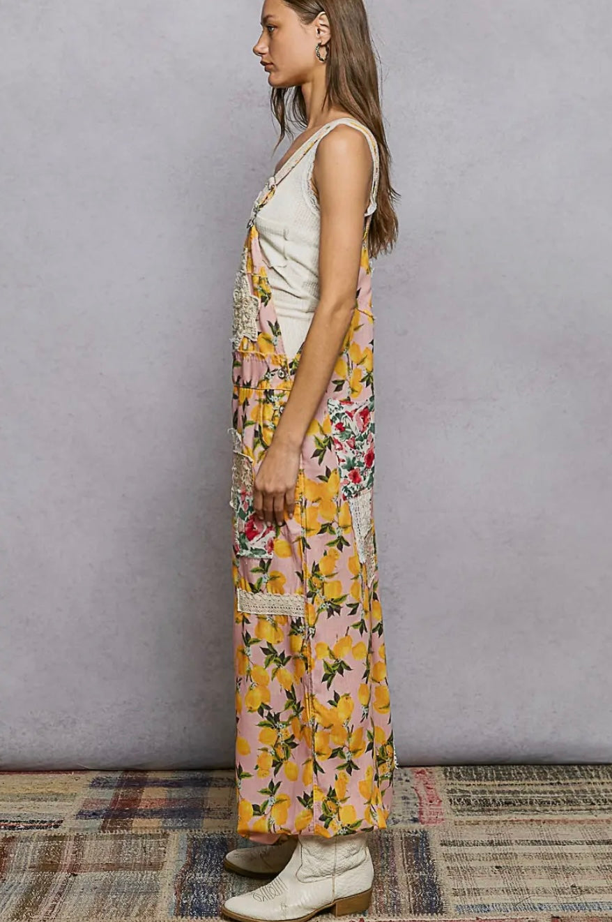 Woman wearing a floral dress with a plain background