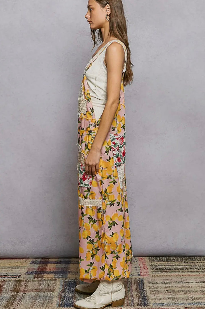 Woman wearing a floral dress with a plain background