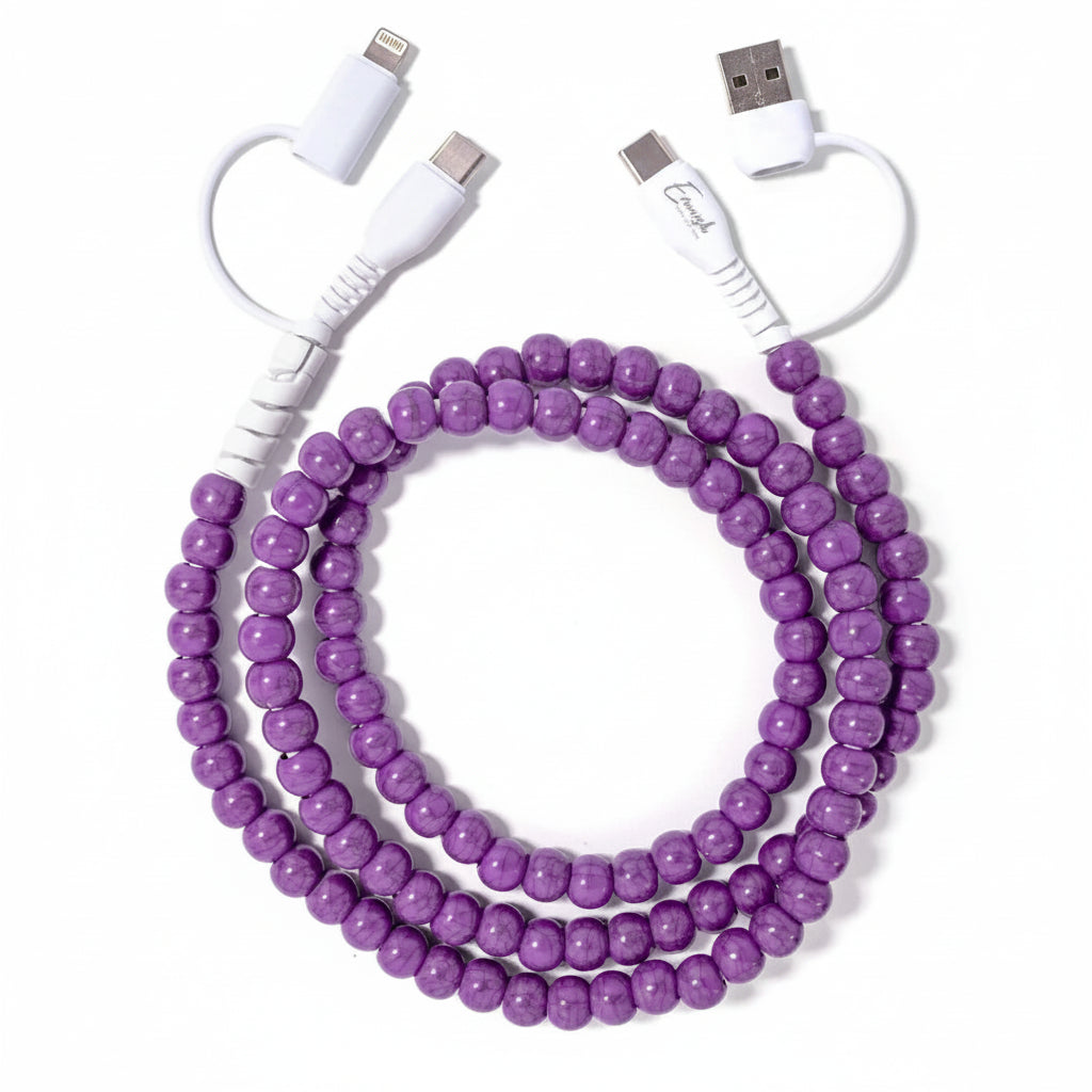 Purple beaded cable with white connectors on a white background