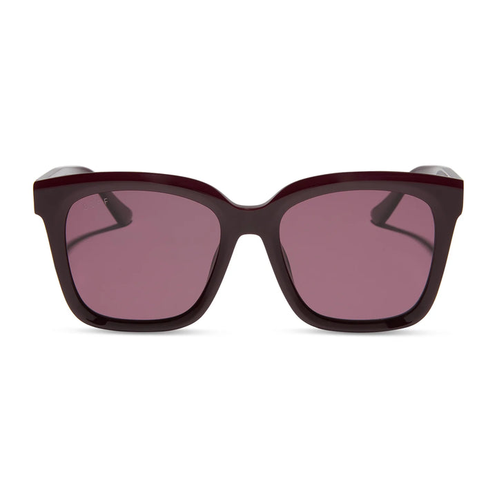 Sunglasses with dark brown frame and pink lenses on a white background